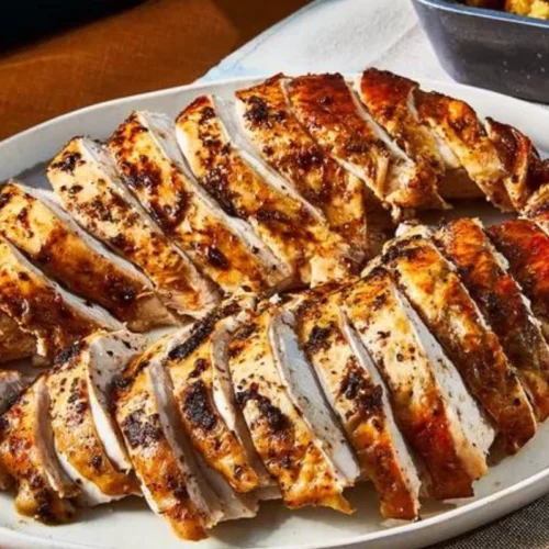 This succulent turkey breast is infused with aromatic herbs, perfectly seasoned, and baked to perfection, resulting in tender and juicy slices that are simply irresistible.