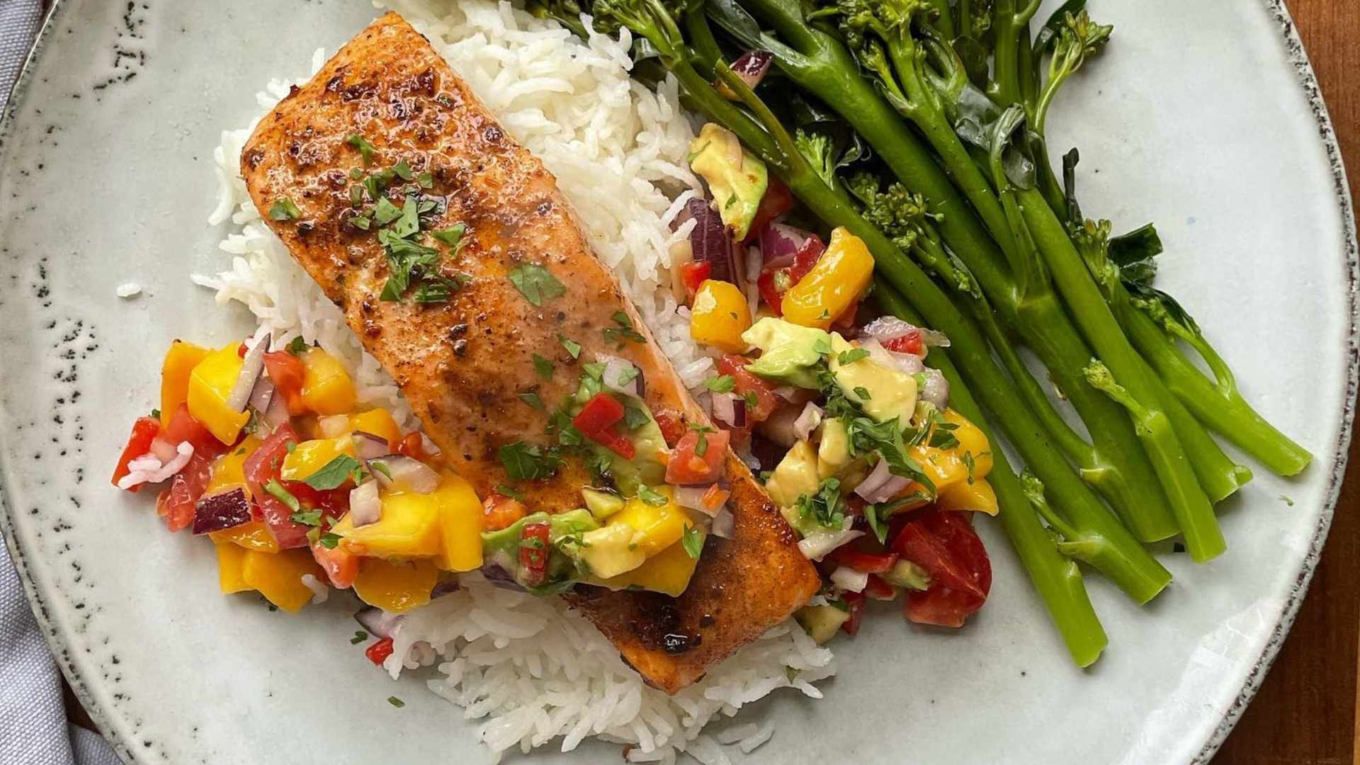 Cajun salmon with avocado & mango salsa