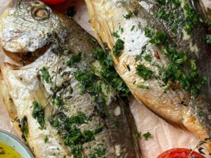 Whole baked sea bream with thyme, lemon and garlic