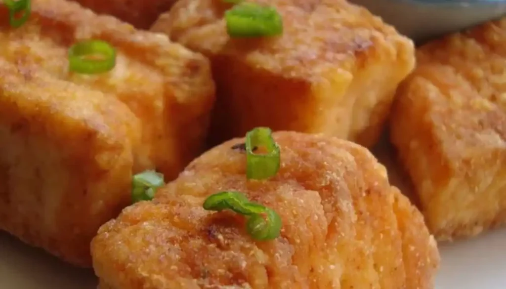 These delectable bite-sized morsels feature succulent salmon marinated in a harmonious blend of spices, grilled to perfection, and served with a zesty twist.