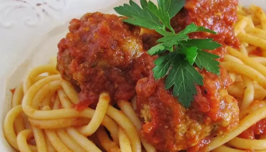 This classic Italian dish features perfectly tender meatballs made with a blend of premium meats and savory herbs, simmered in a rich tomato sauce bursting with flavor.