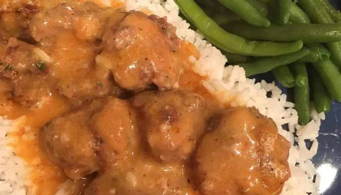 These tender and flavorful meatballs, made with a perfect blend of ground beef and pork, are delicately seasoned and cooked to perfection.