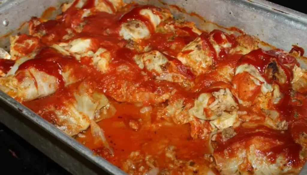 This traditional dish features tender cabbage leaves carefully wrapped around a savory blend of ground meat, rice, and aromatic seasonings.