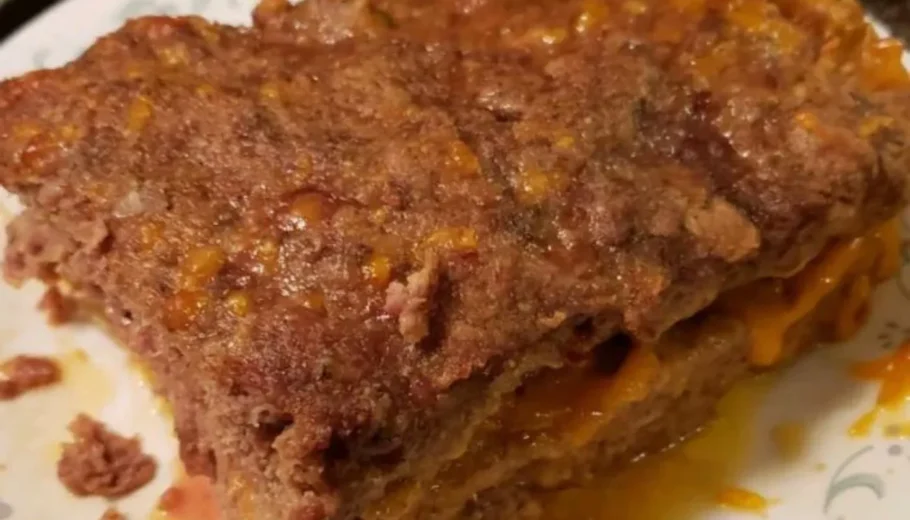 This mouthwatering dish features a juicy meatloaf generously filled with gooey melted cheese, creating a delightful surprise in every bite.