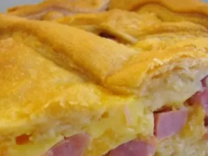 This delectable dish combines tender ham, gooey cheese, and flaky crescent rolls for a mouthwatering culinary experience.