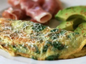 his protein-packed dish combines fluffy eggs with a generous amount of nutritious spinach and a delectable blend of cheeses.