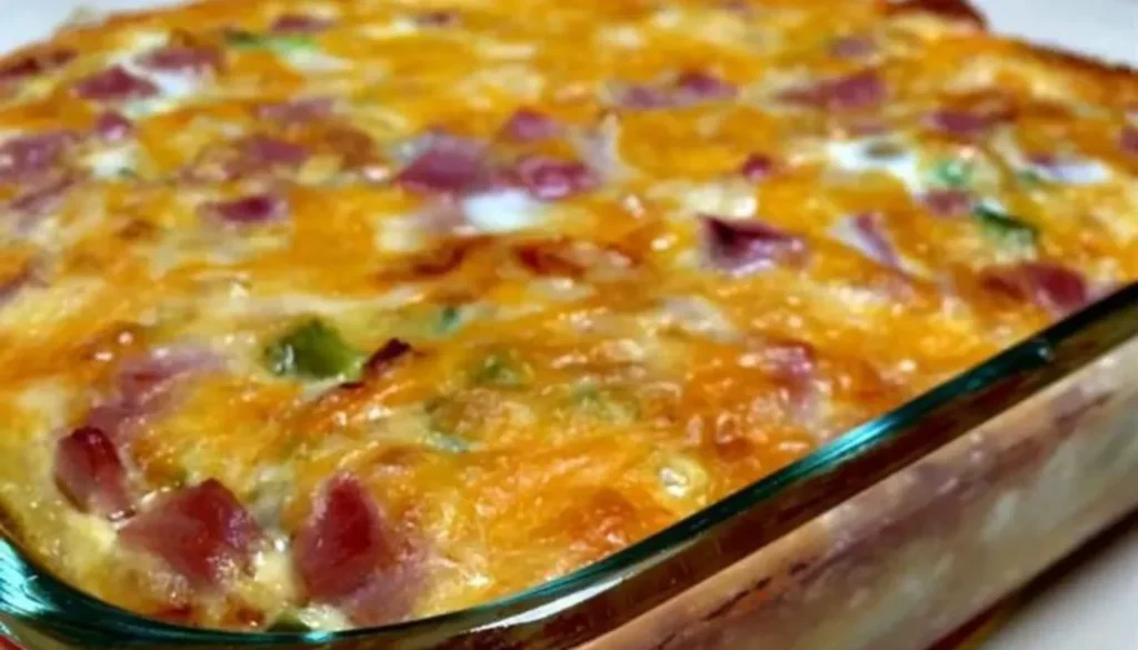 This hearty and delicious breakfast dish combines savory sausage, fluffy eggs, crispy hash browns, and melted cheese for a taste that will leave you energized and ready to conquer the day.