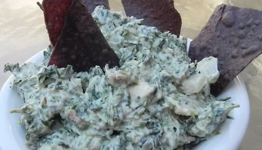 This crowd-pleasing appetizer features a luscious blend of creamy cheeses, tangy sour cream, and vibrant spinach. Perfect for any gathering or party, this easy-to-make dip is a surefire hit that will leave your taste buds craving for more.
