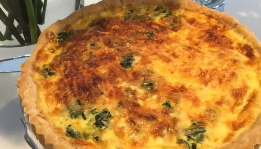 This mouthwatering dish features a classic quiche Lorraine with a delectable twist of Swiss cheese, resulting in a culinary masterpiece that will satisfy your taste buds.