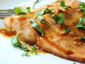 This dish features succulent salmon fillets coated with a delectable maple syrup glaze, creating the perfect balance of sweet and savory.