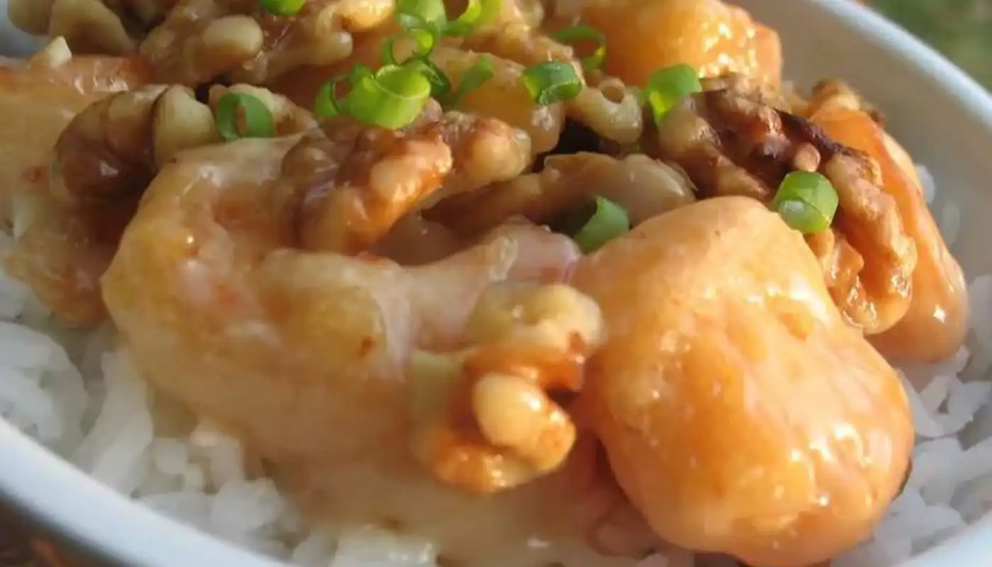 Sweet and Crunchy Walnut Shrimp is a delightful dish that combines succulent shrimp with a crispy coating of crushed walnuts. The shrimp are first coated in a light batter and then generously rolled in crushed walnuts before being fried to a golden perfection.