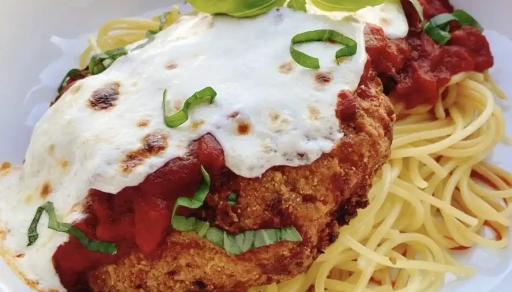 This mouthwatering dish features tender, crispy chicken cooked to perfection in the air fryer, paired with a savory spaghetti sauce.