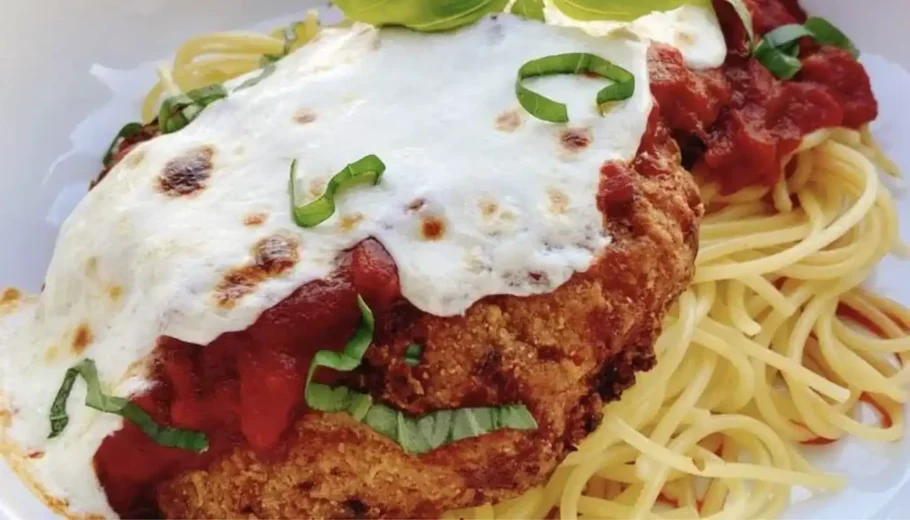This mouthwatering dish features tender, crispy chicken cooked to perfection in the air fryer, paired with a savory spaghetti sauce.