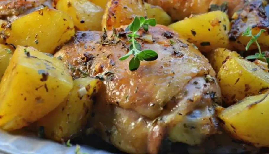 This Greek-inspired dish features succulent chicken perfectly seasoned with aromatic herbs and spices, paired with tender, golden potatoes.