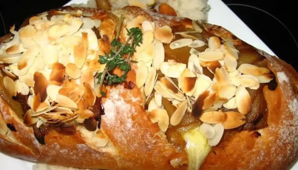 Elevate your appetizer game with our exquisite Baked Brie recipe featuring a delectable combination of caramelized pears, shallots, and thyme. Indulge in the creamy goodness of melted Brie cheese, perfectly complemented by the sweet and savory blend of caramelized pears and aromatic shallots.
