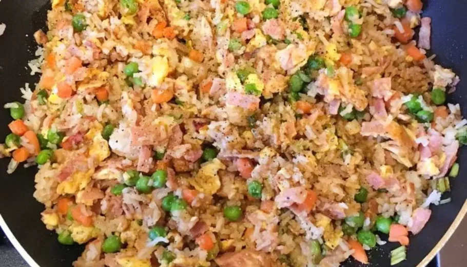 This mouthwatering dish combines tender chunks of ham with fluffy rice, crisp vegetables, and savory seasonings.