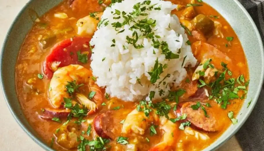 This soul-warming dish combines succulent shrimp, tender chicken, and smoky sausage with a rich blend of spices and a dark, roux-based sauce.