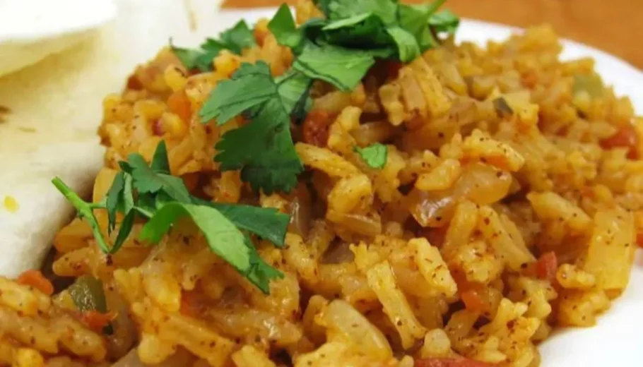 This savory dish combines perfectly cooked rice with a medley of aromatic spices, tender vegetables, and zesty tomatoes, creating a symphony of taste that will transport you to the streets of Barcelona.