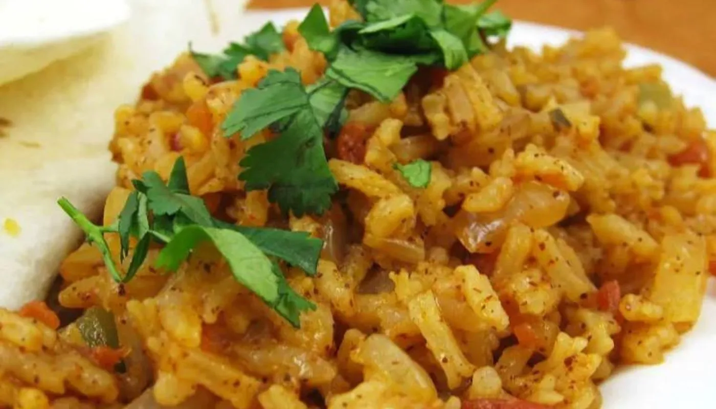 This savory dish combines perfectly cooked rice with a medley of aromatic spices, tender vegetables, and zesty tomatoes, creating a symphony of taste that will transport you to the streets of Barcelona.