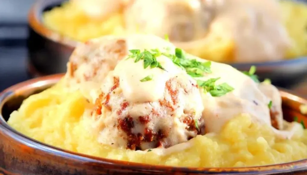 These succulent homemade meatballs, seasoned to perfection with a blend of aromatic spices, are lovingly cooked in a rich, velvety gravy.