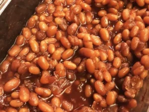 This comforting recipe combines tender beans, slow-cooked to perfection in a rich, savory sauce, boasting a delightful blend of smoky bacon, tangy tomato, and a hint of sweet molasses.