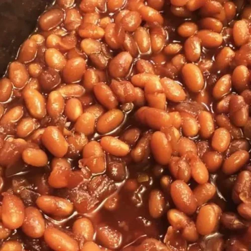 This comforting recipe combines tender beans, slow-cooked to perfection in a rich, savory sauce, boasting a delightful blend of smoky bacon, tangy tomato, and a hint of sweet molasses.