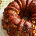 This delectable dessert features soft, doughy bites coated in a sweet cinnamon glaze.