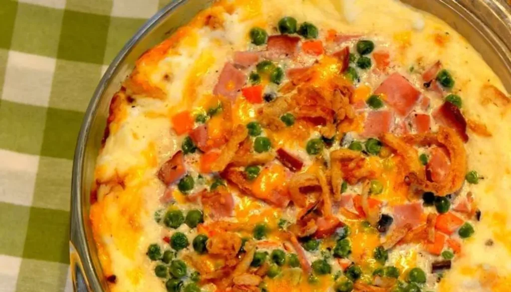 Layers of creamy mashed potatoes, savory diced ham, and rich cheddar cheese come together to create a mouthwatering casserole that's perfect for any occasion.