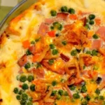 Layers of creamy mashed potatoes, savory diced ham, and rich cheddar cheese come together to create a mouthwatering casserole that's perfect for any occasion.