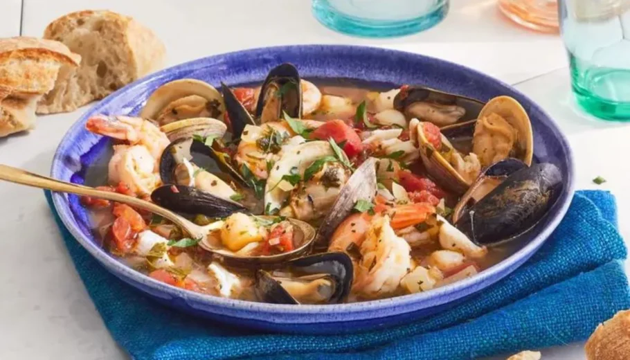 This savory seafood stew combines the freshest catch of the day with a tantalizing blend of tomatoes, herbs, and aromatic spices, creating a true coastal delight.