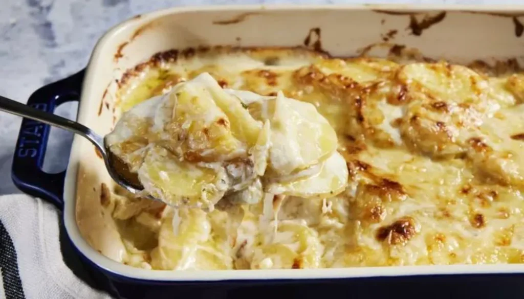 This irresistible dish combines tender sliced potatoes with a velvety, garlic-infused cream sauce, baked to perfection.