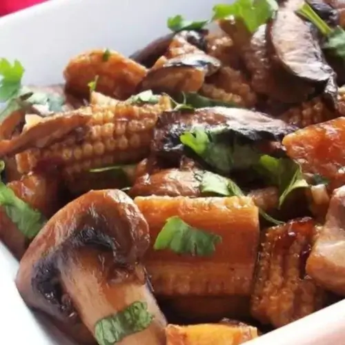This savory medley combines perfectly sautéed mushrooms and tender baby corn, creating a symphony of flavors that will tantalize your taste buds.