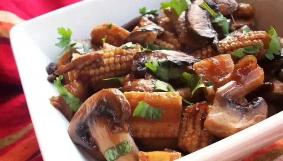 This savory medley combines perfectly sautéed mushrooms and tender baby corn, creating a symphony of flavors that will tantalize your taste buds.