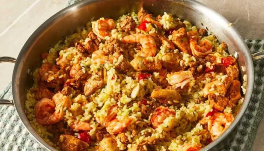This mouthwatering dish brings together a medley of aromatic spices, tender chicken, succulent shrimp, and vibrant vegetables, all cooked to perfection in a single pot.