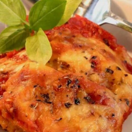 Crispy and flavorful, this dish features tender eggplant slices coated in a delightful blend of Parmesan cheese and savory herbs, baked to perfection.