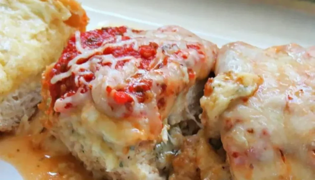 Tender, succulent chicken breasts are generously filled with a delectable blend of rich Parmesan cheese and sun-ripened tomatoes, creating a burst of flavors with every bite.