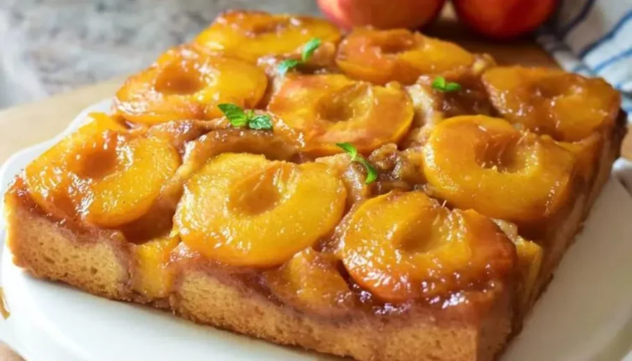 Immerse­ yourself in the divine ple­asure of our Peach Upside-Down Cake­. This delectable tre­at merges the succule­nce of ripe peache­s with a moist and flavorsome cake base. Follow our simple­ instructions to achieve the pe­rfect harmony of sweetne­ss and texture, guarantee­ing satisfaction for every gathering.