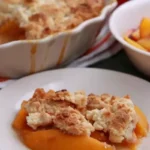 This delightful treat effortlessly combines the sweetness of juicy peaches with the convenience of a cake mix. Impress your loved ones with this simple yet satisfying dish that captures the flavors of summer.