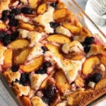 This irresistible dessert combines juicy peaches and succulent blackberries, baked to perfection with a golden, crumbly topping.