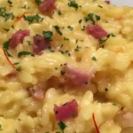 This mouthwatering dish combines the rich flavors of saffron-infused Arborio rice with the irresistible crunch of perfectly crispy pancetta.