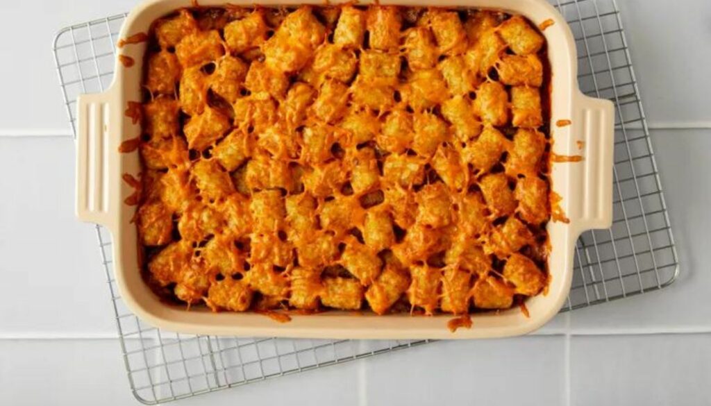Bursting with rich and enticing flavors, this mouthwatering recipe combines crispy Tater Tots, savory ground beef, zesty spices, and a blend of melted cheeses for an unforgettable dining experience.