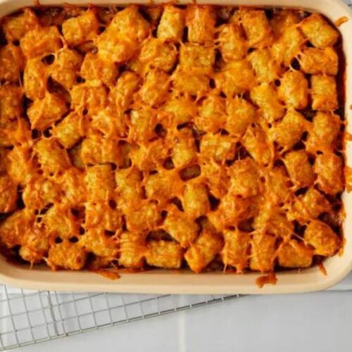 Bursting with rich and enticing flavors, this mouthwatering recipe combines crispy Tater Tots, savory ground beef, zesty spices, and a blend of melted cheeses for an unforgettable dining experience.
