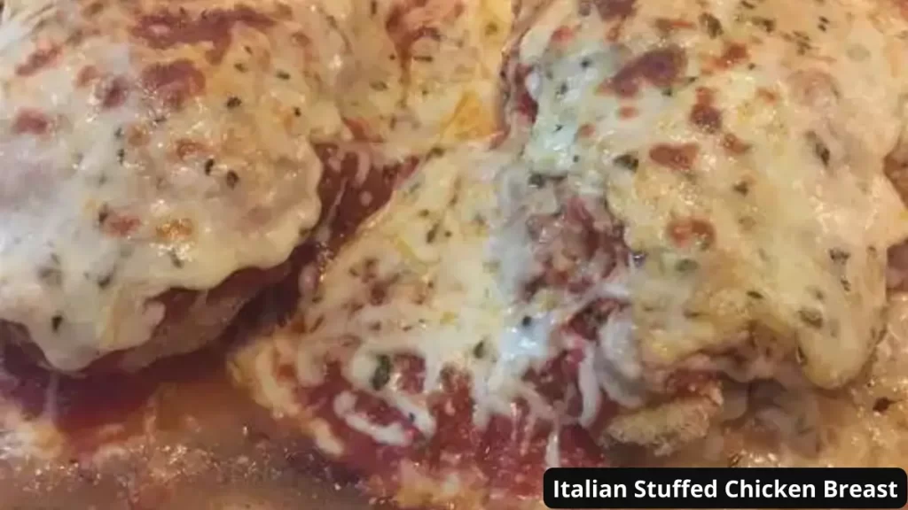 Close-up view of baked Italian Stuffed Chicken Breasts covered in melted cheese and marinara sauce.