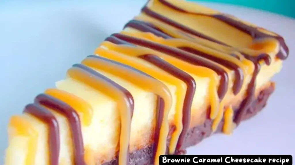 A slice of Brownie Caramel Cheesecake drizzled with caramel and chocolate fudge topping, showcasing the rich layers.