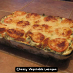 A delicious and hot cheesy vegetable lasagna fresh out of the oven.