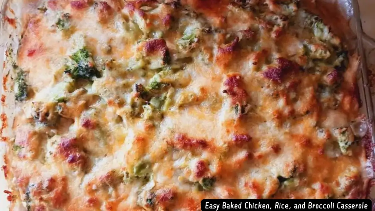 Close-up view of a golden, cheesy Easy Baked Chicken, Rice, and Broccoli Casserole in a baking dish.