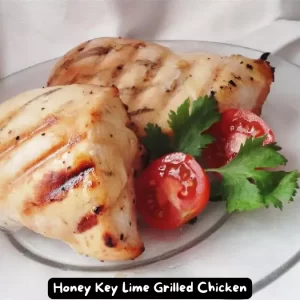 Grilled chicken breast marinated in honey and key lime juice on a barbecue grill