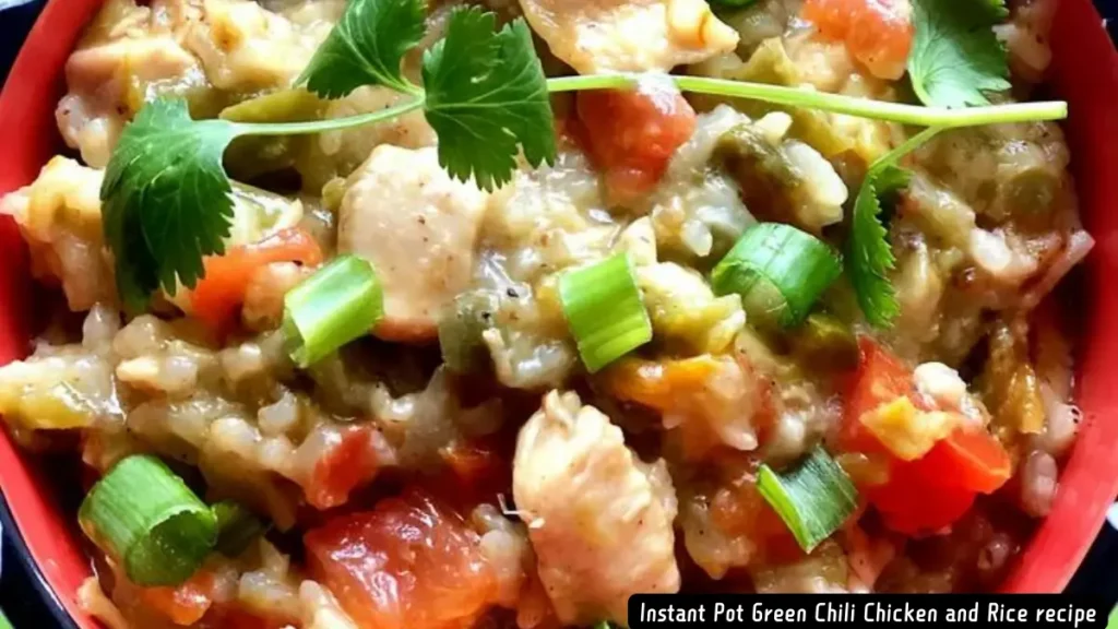 A close-up of a bowl of Instant Pot Green Chili Chicken and Rice garnished with cilantro and green onions.