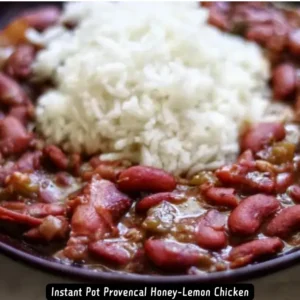 A hearty bowl of Instant Pot NOLA Red Beans and Rice garnished with fresh herbs.