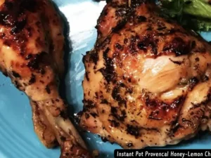 A beautifully browned honey-lemon chicken Recipe with herbs, cooked in an Instant Pot and served with a flavorful sauce.